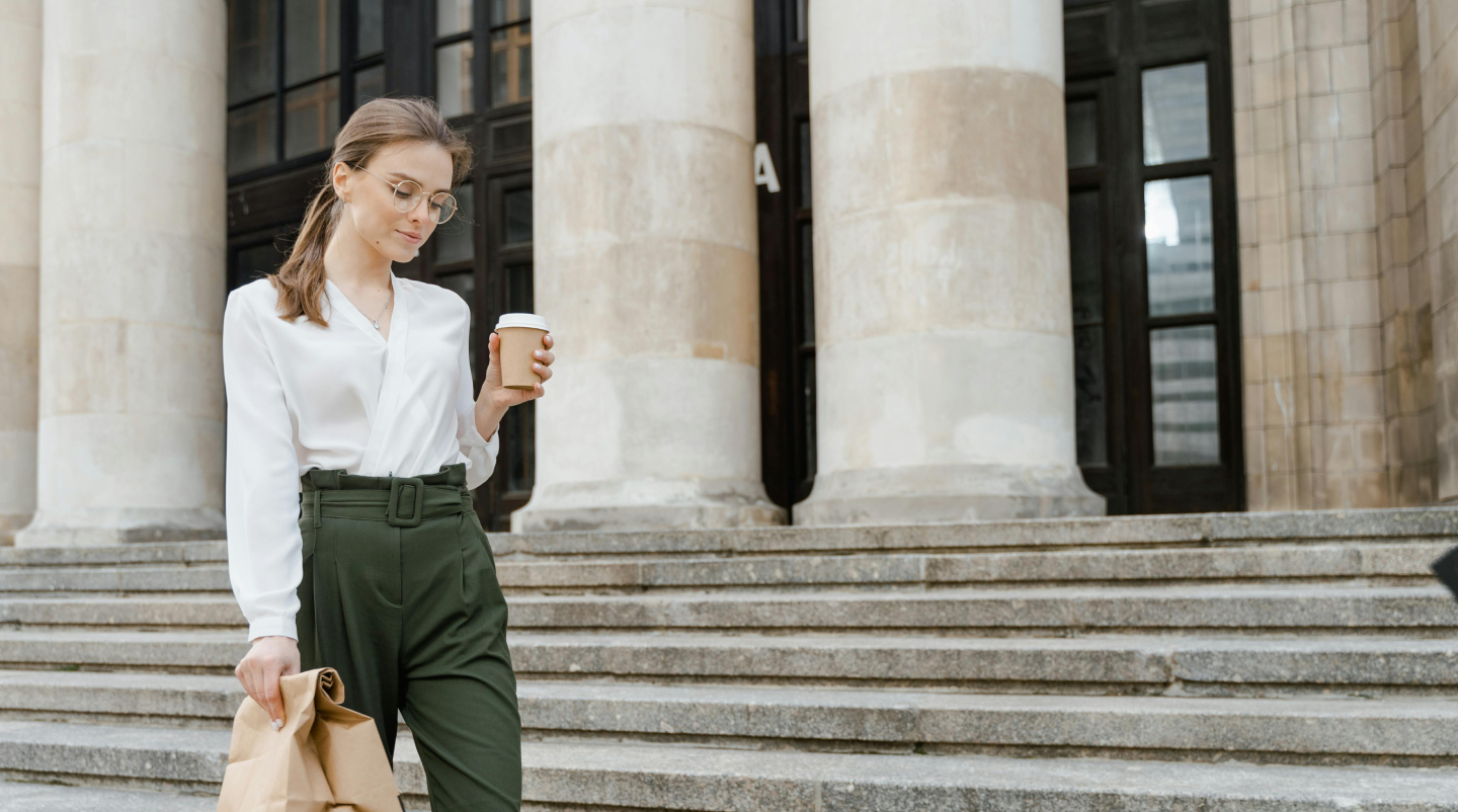 Woman with coffee and paper bag